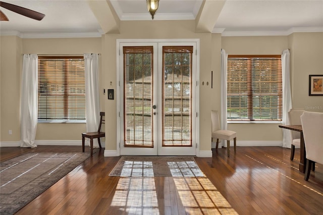 doorway to outside with dark hardwood / wood-style flooring, ceiling fan, french doors, and ornamental molding