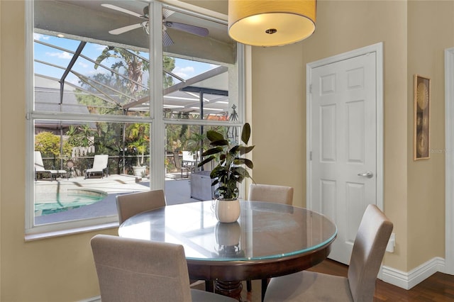 dining room with hardwood / wood-style floors and ceiling fan