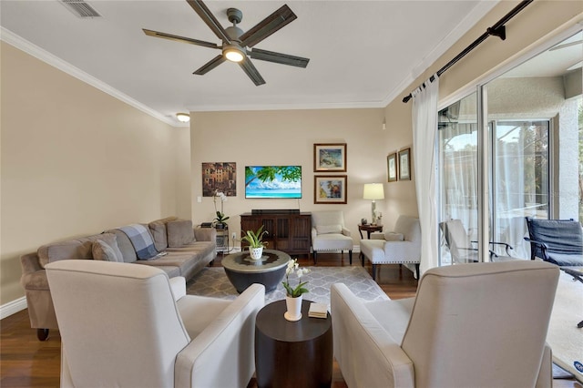 living room featuring hardwood / wood-style floors, ceiling fan, and crown molding