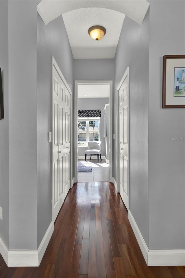 hallway featuring dark hardwood / wood-style floors