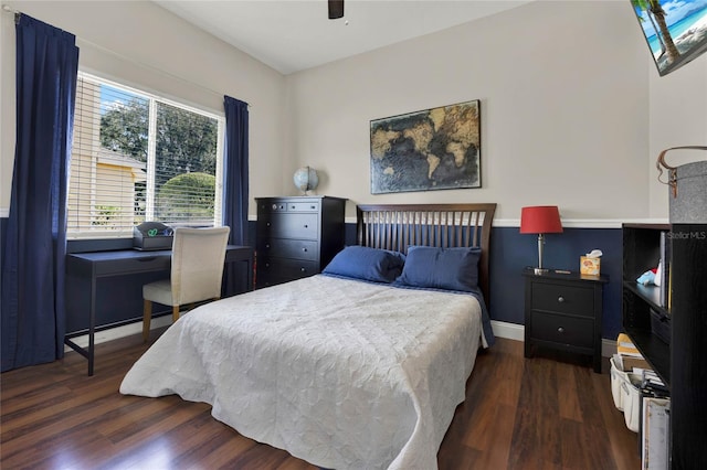 bedroom featuring ceiling fan and dark hardwood / wood-style flooring