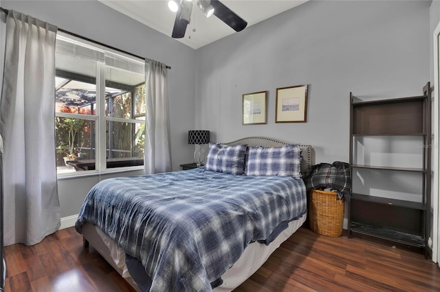 bedroom featuring dark hardwood / wood-style flooring and ceiling fan