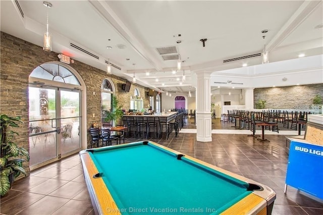 game room featuring ornate columns, billiards, dark tile patterned flooring, and indoor bar