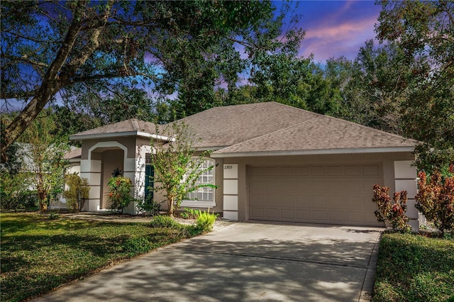 ranch-style home with a garage