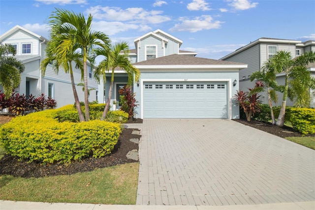 307 Shore Crab Way, Apollo Beach, FL 33572 - view of front facade featuring a garage, decorative driveway, and stucco siding