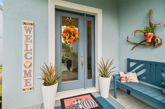 307 Shore Crab Way, Apollo Beach, FL 33572 - doorway to property with stucco siding