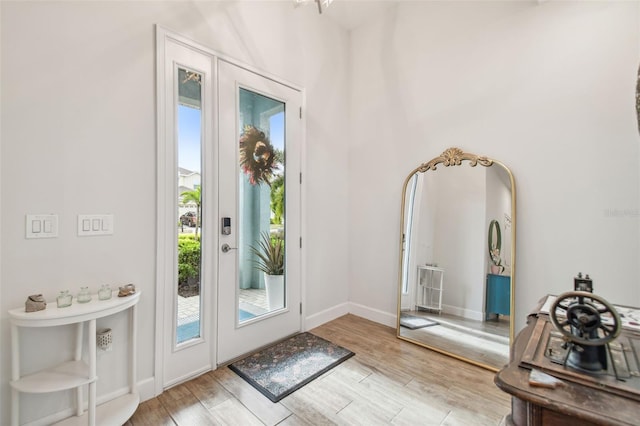 doorway to outside with light wood-type flooring