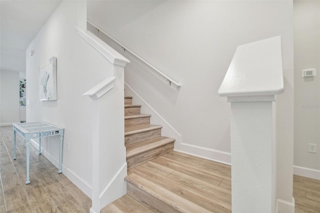 307 Shore Crab Way, Apollo Beach, FL 33572 - stairs featuring wood finished floors and baseboards