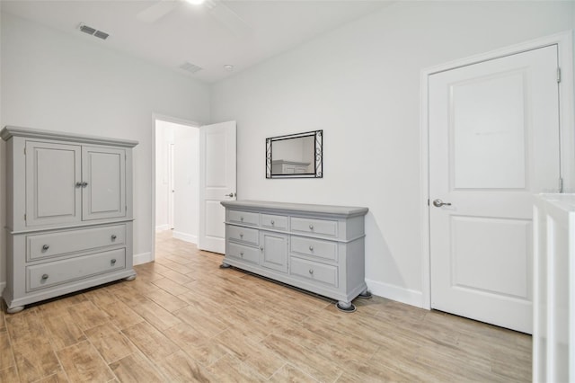 bedroom with ceiling fan and light wood-type flooring