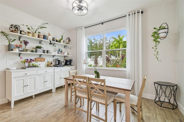 dining area with light wood-type flooring