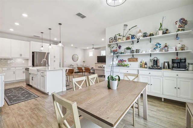 307 Shore Crab Way, Apollo Beach, FL 33572 - dining room with recessed lighting, light wood-style flooring, and ceiling fan