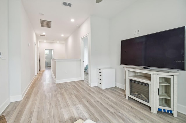 unfurnished living room with light wood-type flooring