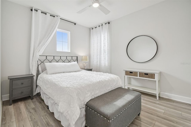 bedroom featuring light wood-type flooring and ceiling fan