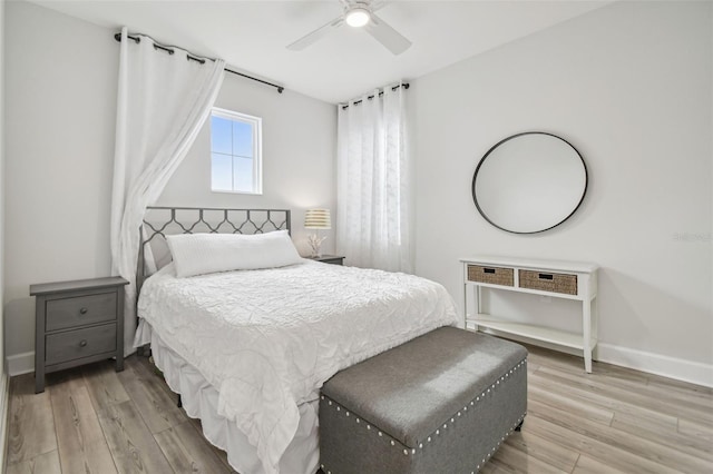 307 Shore Crab Way, Apollo Beach, FL 33572 - bedroom with light wood finished floors, baseboards, and ceiling fan