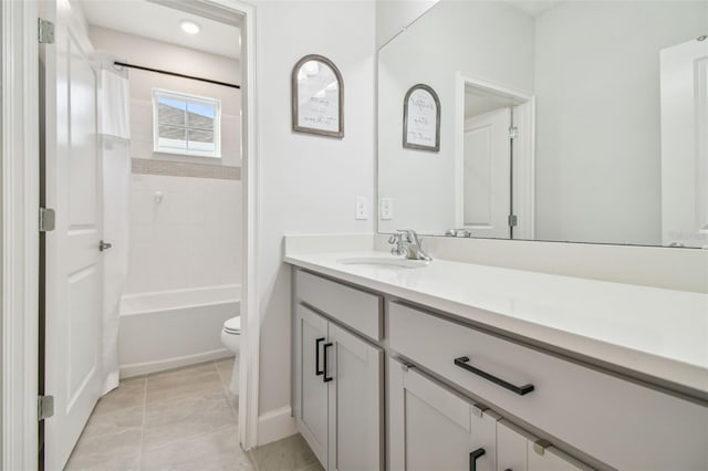 full bathroom with tub / shower combination, tile patterned flooring, vanity, and toilet