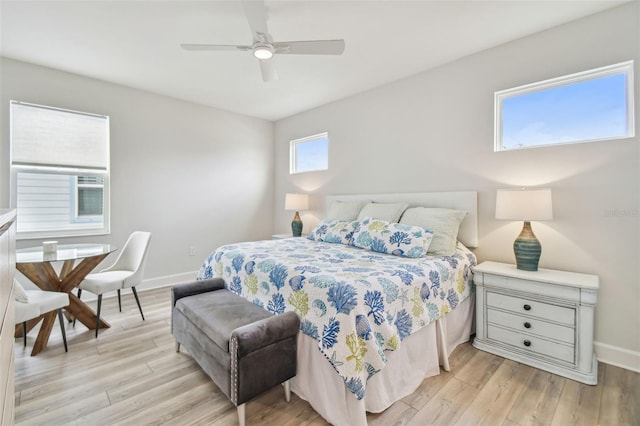 bedroom with light hardwood / wood-style flooring and ceiling fan