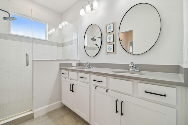 307 Shore Crab Way, Apollo Beach, FL 33572 - bathroom featuring a stall shower, double vanity, and tile patterned floors