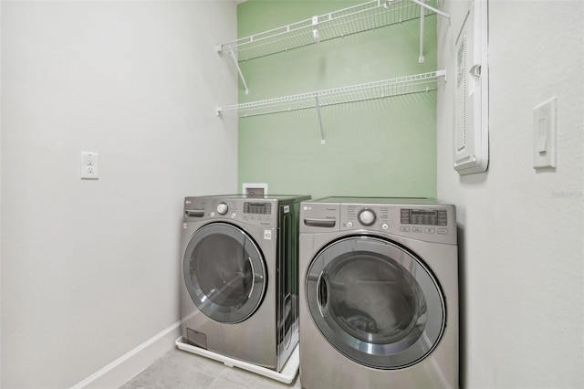 washroom featuring independent washer and dryer and tile patterned floors