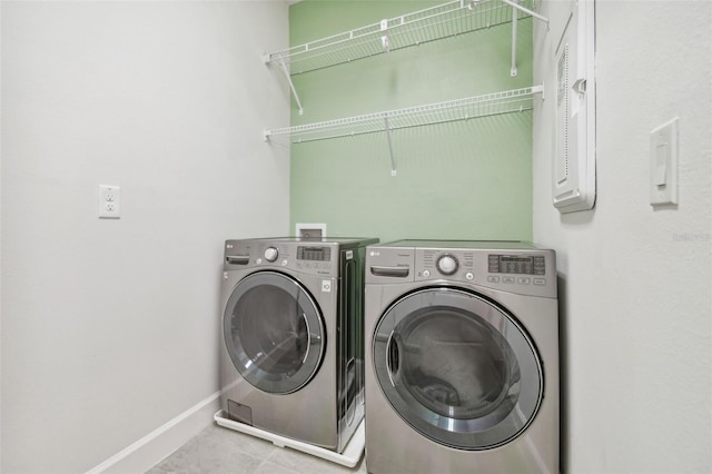 307 Shore Crab Way, Apollo Beach, FL 33572 - washroom with washer and clothes dryer, baseboards, and tile patterned flooring