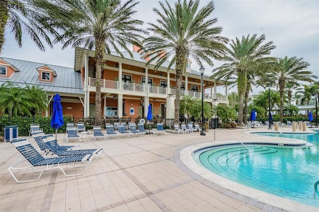 view of swimming pool featuring a patio area