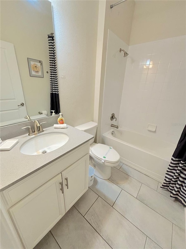 full bathroom featuring vanity, tile patterned flooring, toilet, and shower / tub combo