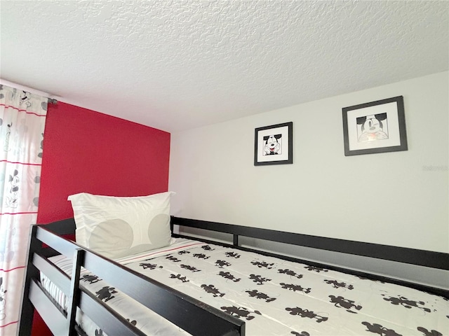 bedroom featuring a textured ceiling