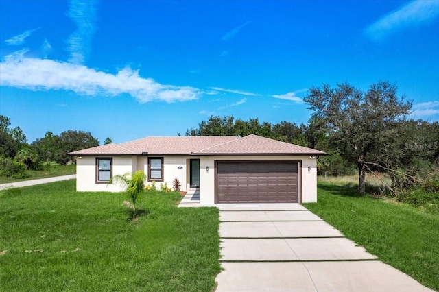 ranch-style home featuring a garage and a front lawn