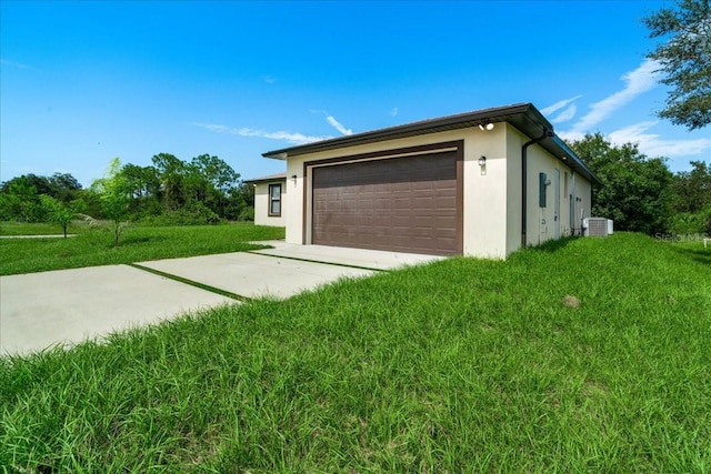 garage featuring a lawn