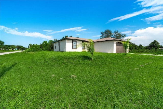 view of property exterior with a yard