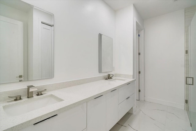 bathroom featuring vanity and an enclosed shower