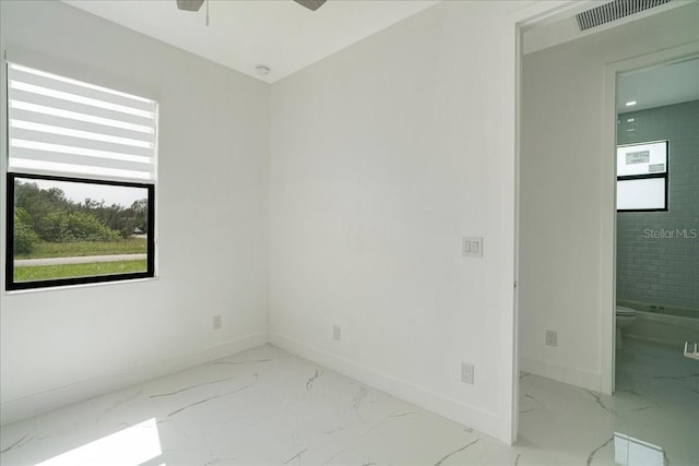 spare room featuring ceiling fan