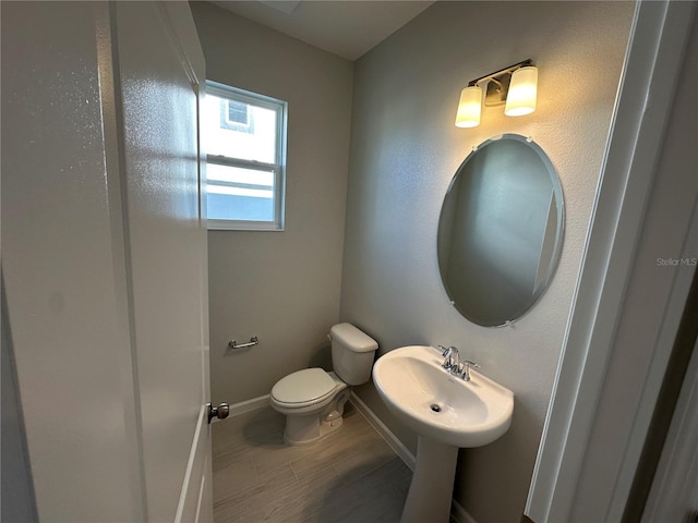 bathroom with toilet and sink