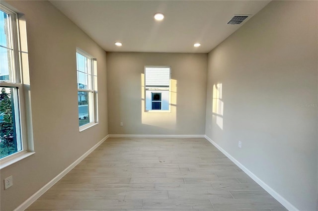 empty room with light hardwood / wood-style floors