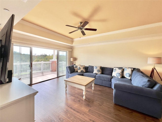 7612 Cabana Ct Unit 303, Reunion, FL 34747 - living area featuring a raised ceiling, ornamental molding, ceiling fan, and hardwood / wood-style flooring