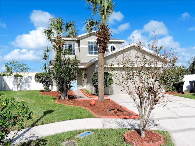 view of front of home with a garage and a front lawn