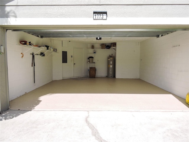 garage with electric panel and water heater