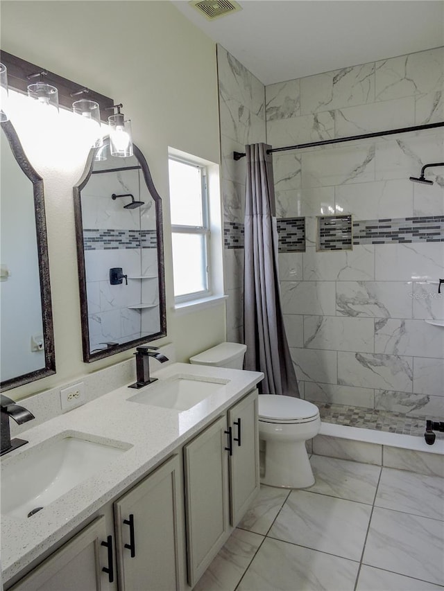 bathroom with vanity, a shower with curtain, and toilet