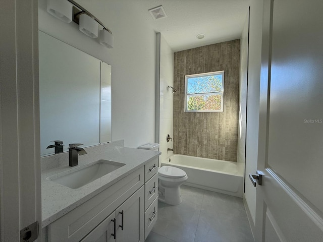 full bathroom featuring tile patterned flooring, vanity, toilet, and tiled shower / bath