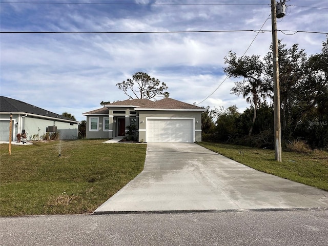 view of front of house featuring a front lawn and a garage