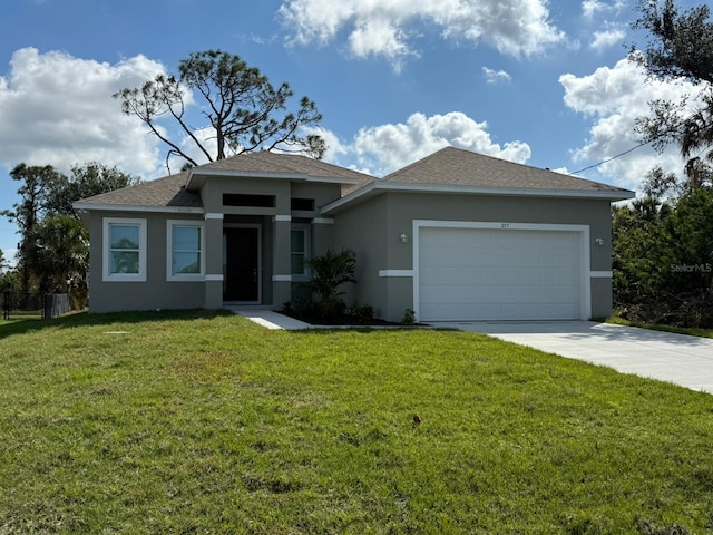 view of front of home with a garage and a front yard