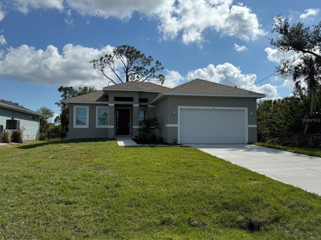 view of front facade featuring a garage and a front yard