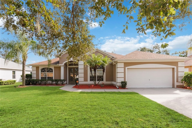 view of front of property with a garage and a front yard