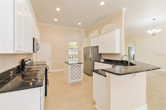 kitchen featuring crown molding, appliances with stainless steel finishes, sink, white cabinets, and kitchen peninsula