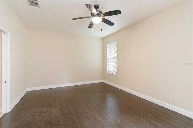 empty room featuring ceiling fan and dark hardwood / wood-style floors