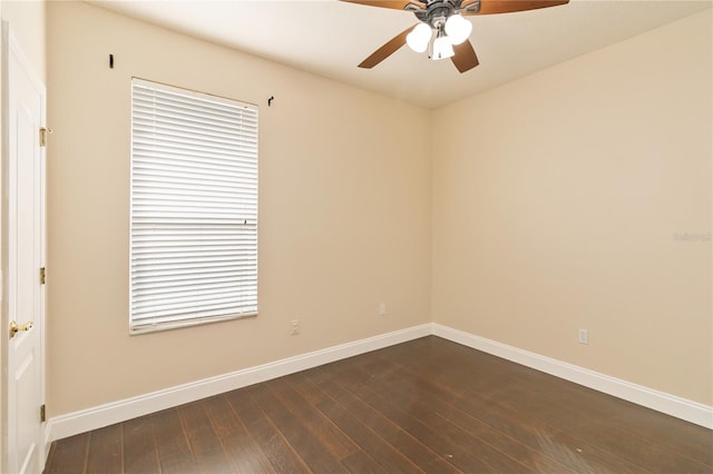 spare room featuring ceiling fan and dark hardwood / wood-style floors