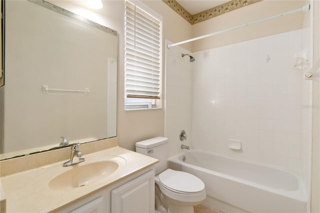 full bathroom with vanity, toilet, and tiled shower / bath