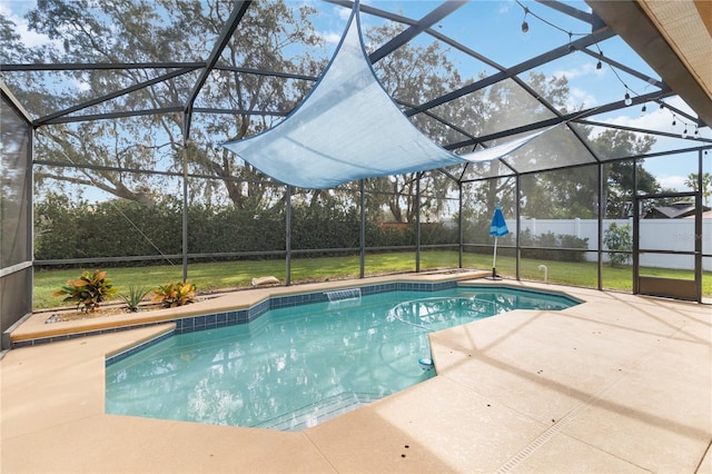 view of pool with a lawn, a lanai, and a patio