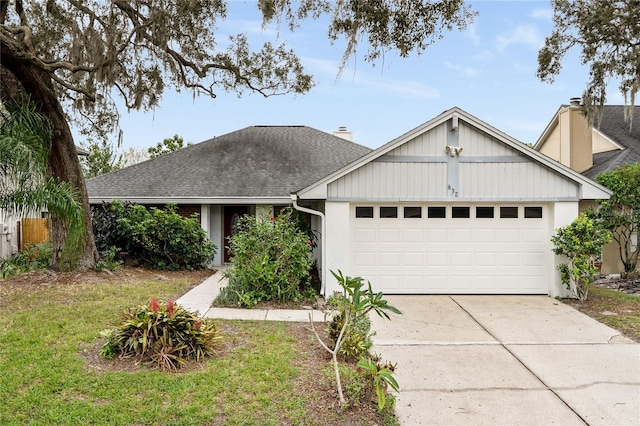 ranch-style house with a garage and a front lawn