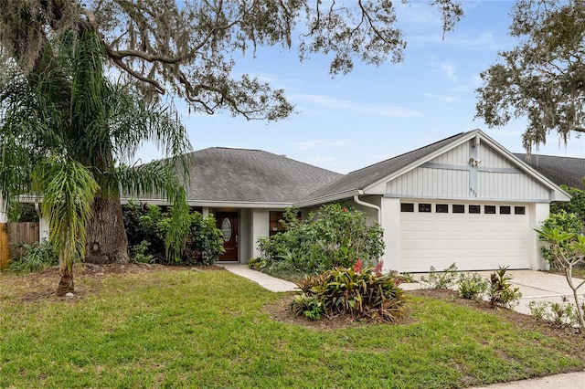 ranch-style house with a front yard and a garage