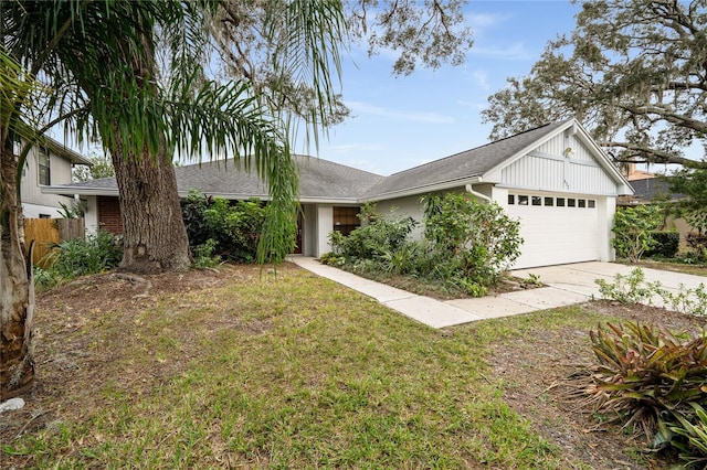 single story home featuring a garage and a front lawn